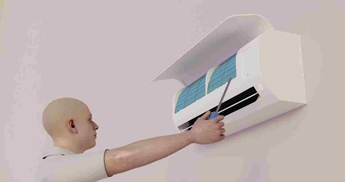 Technician installing an energy-efficient air conditioning unit.