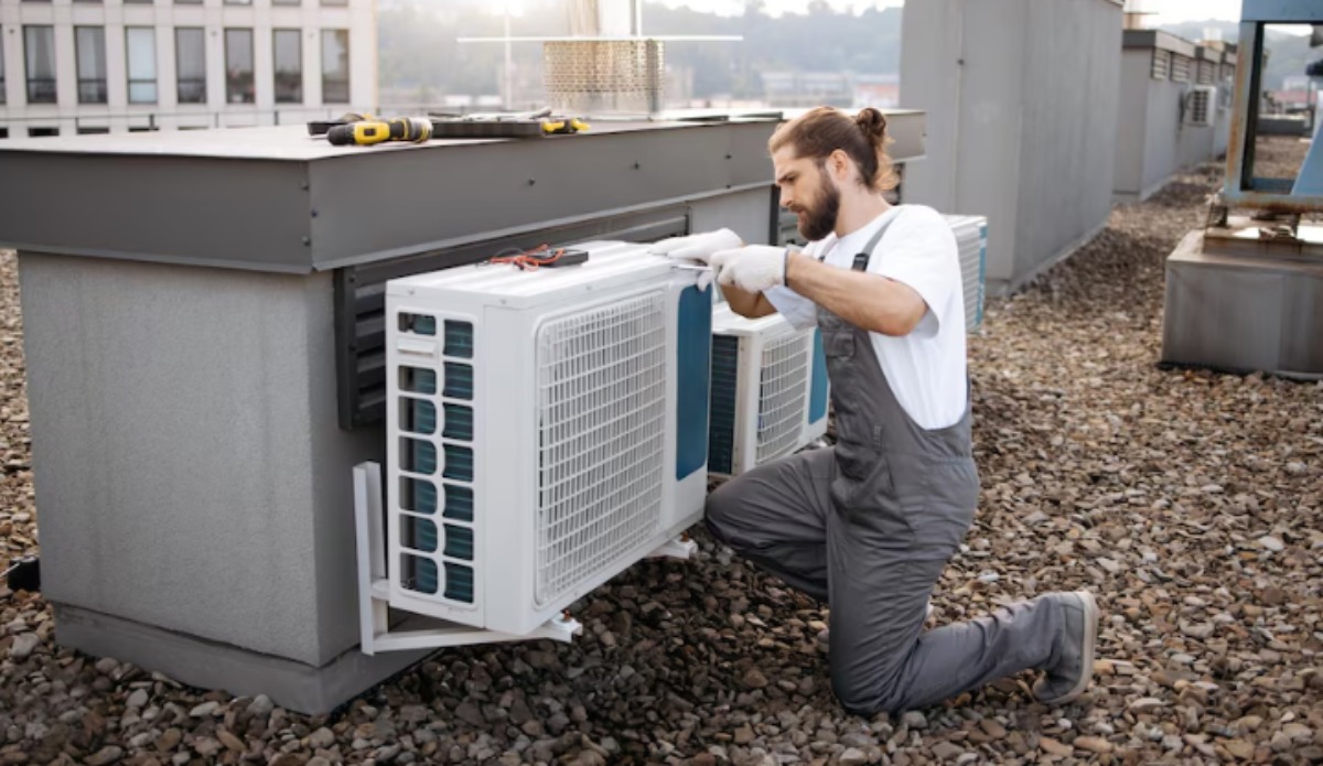 Technician performing air conditioning service, maintenance, and installation